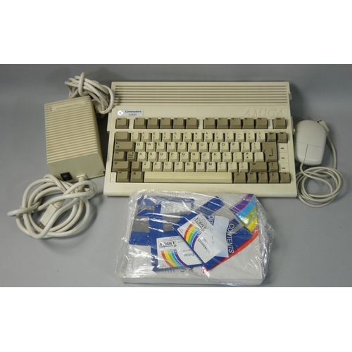 113 - A Commodore Amiga A600, together with power supply unit, Commodore mouse, Smiga Workbench V2.05, thr... 