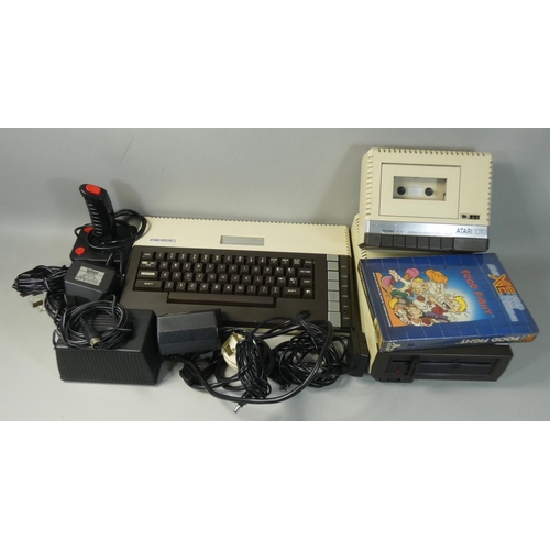 126 - An Atari 800XL personal computer, together with an Atari 1050 flopy disk drive, an Atari 1010 tape d... 