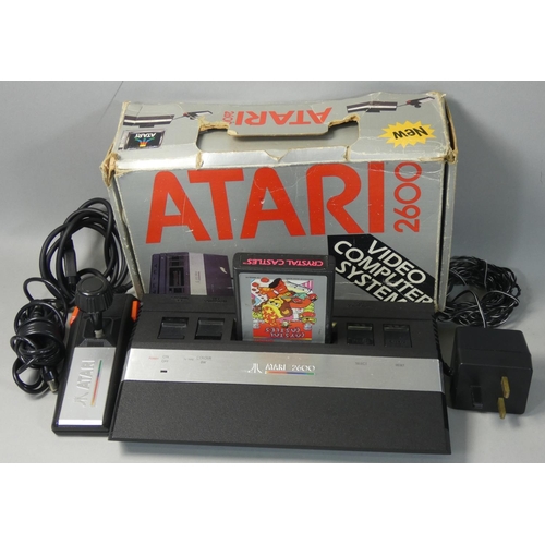 122 - A boxed Atari 2600 JR personal computer, serial No. AT850086907, with PSU, new style controller, tel... 