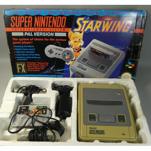 116 - A boxed Super Nintendo Entertainment System (PAL version), complete with two control pads, power sup... 