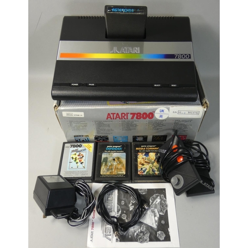 123 - A boxed Atari 7800 video game system, with power supply unit, two mini-stick controllers and televis... 