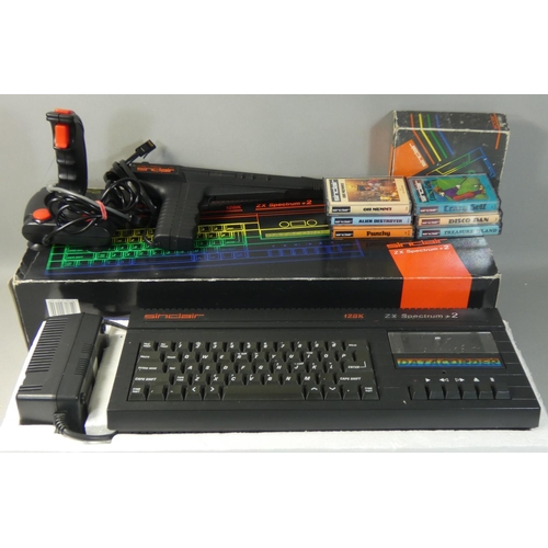 118 - A boxed Sinclair ZX Spectrum +2A in black, with power supply unit, manual and television lead, toget... 