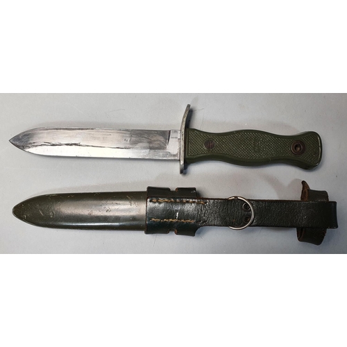 69 - A Bundeswehr German Army Fighting Knife HSK70, with 14cm single edge blade, moulded green plastic sh... 