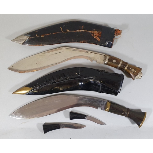 71 - An Indian Kukri, with horn hilt and prick dot decoration, together with another Kukri with hardwood ... 