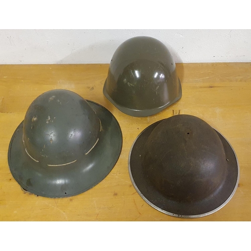 62 - A English WWII type helmet, an USA helmet and another helmet, no markings (3).