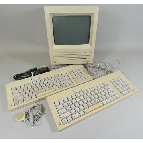 108 - An early Macintosh SE FDHD personal computer, together with two keyboards, mouse, power cable and mi... 