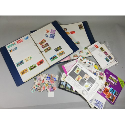 102 - An extensive collection of stamps, including 2 albums of unused stamps with categories to include 'E... 