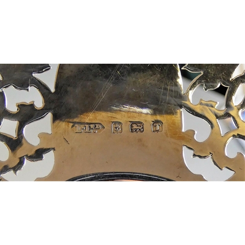 4 - A silver pair of pierced bon bon dishes, Birmingham 1943, diameter 12cm, 3.5 oz, case.