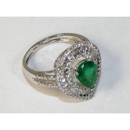 48 - An 18ct white gold emerald and diamond pear shape ring, claw set with a mixed cut stone, weight 1.38... 