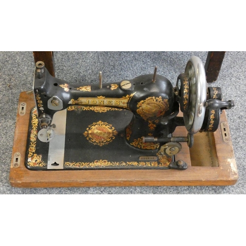 159 - A Edwardian mahogany tub chair, together with a manual sewing machine (2).