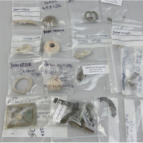 118 - Roman brooches, coin, buckles and other items, together with post medieval and later artifacts found... 