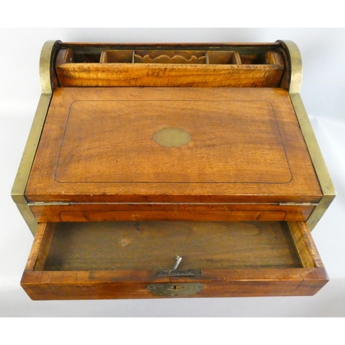 138 - A mahogany and brass band writing slope, the pull drawer lowering the tambour revealing a fitted int... 