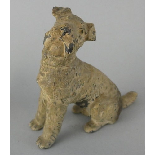 141 - An early 20th century collection of five cold painted lead dogs, to include a Scottie and a Spaniel ... 