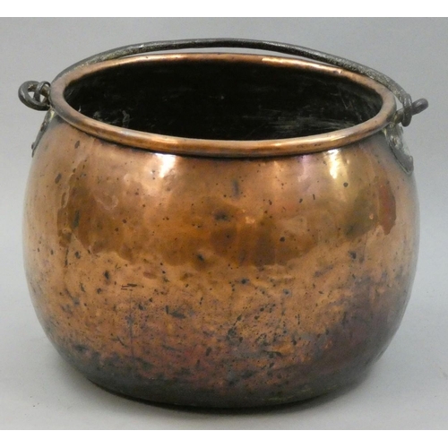 147 - A large copper cauldron with wrought iron swing handle, diameter 37cm