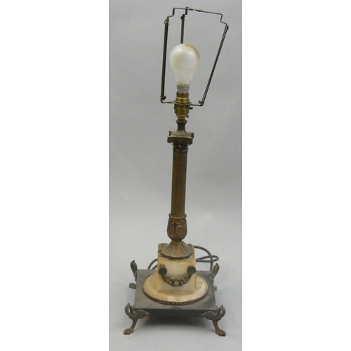 148 - A gilt metal table lamp, the Corinthian column raised on a white marble pedestal to a black marble a... 