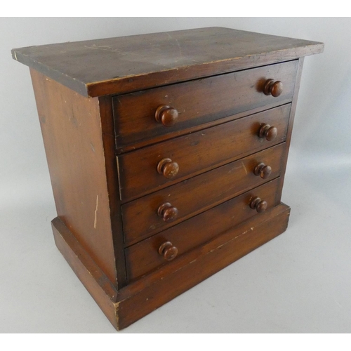 152 - An early 20th century specimen collection of butterflies, housed in a stained pine four draw cabinet... 