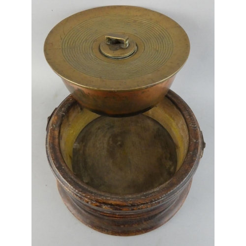 158 - A Victorian brass and copper spitoon in oak case, with screw cap and swing handle, diameter 27 cm.