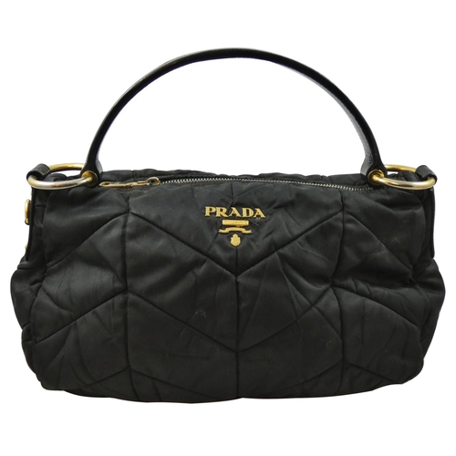 168 - Prada, a black Tessuto Quiltin nylon hand bag, model BR3774, with certificate and dust bag.