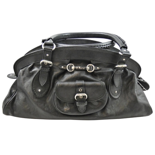 169 - Christian Dior, a black leather hand bag, serial number 01 - RU - 1006, dust bag.