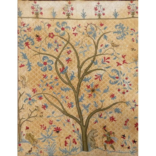 180 - An early 18th century crewelwork panel, composed of three Trees of Life, each with various people, a... 