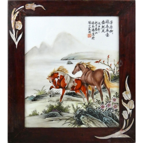 196 - A Chinese porcelain panel, decorated with two horses by a lake, red character mark and calligraphy, ... 