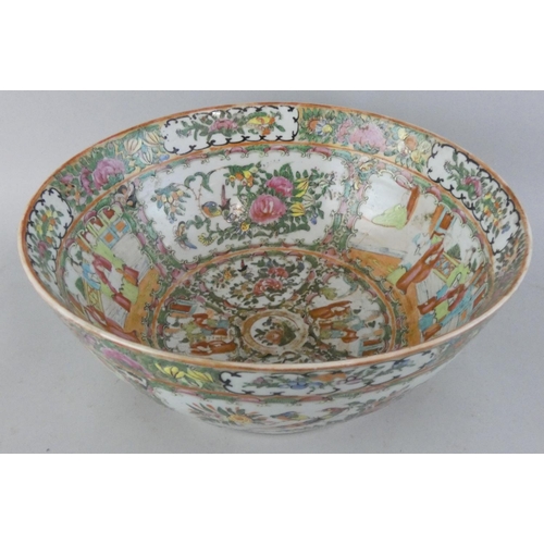 200 - A 19th century Cantonese famille rose bowl, decorated with detailed hand painted vignettes of figure... 