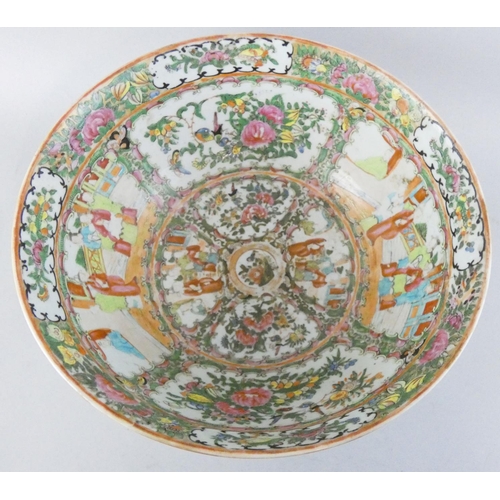 200 - A 19th century Cantonese famille rose bowl, decorated with detailed hand painted vignettes of figure... 