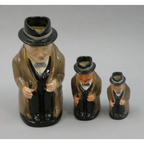 220 - A Royal Doulton set of three graduated Churchill Toby jugs, 23, 13.5, and 10 cm.