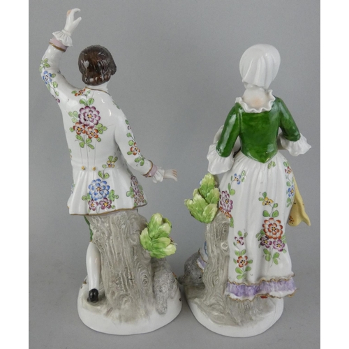 223 - A pair of Sitzendorf porcelain figures, depicting a lady with a tambourine and a gentleman dancing, ... 