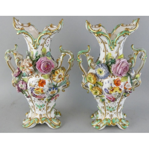 227 - A pair of late 19th century baluster vases, with applied and painted floral decoration, height 27 cm... 