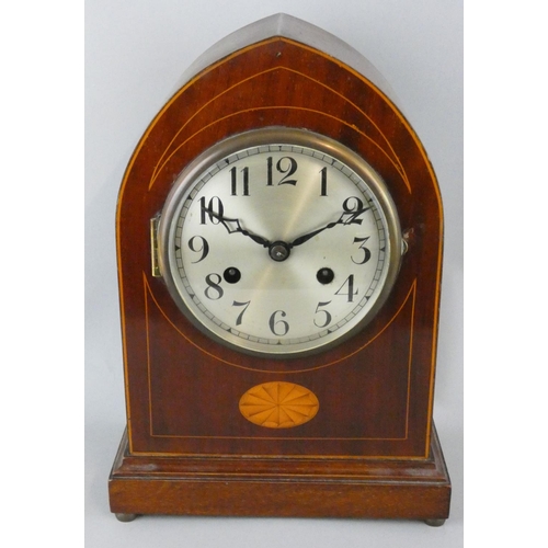 253 - An Edwardian mahogany and boxwood strung mantle clock, the silvered dial with Arabic numerals, the m... 