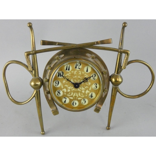 266 - Of equestrian interest, a Victorian novelty brass mantle clock, the pierced dial with Arabic numeral... 