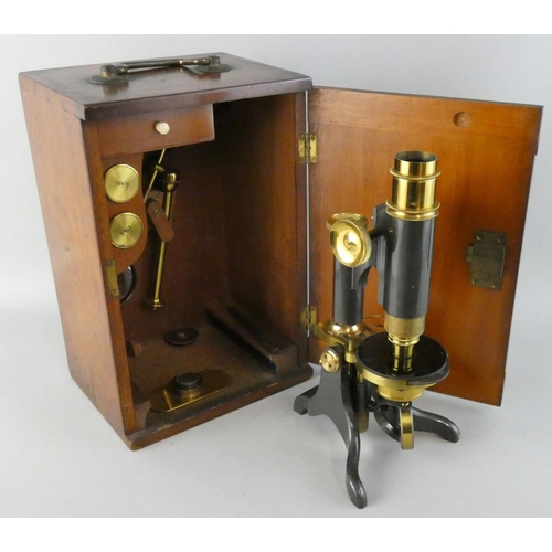 278 - An early 20th century monocular brass and steel microscope, unsigned, together with two lenses, maho... 