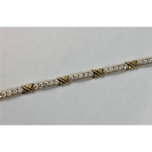 70 - A 9ct gold panel link bracelet, set with cubic zirconia stones, length 19 cm, weight 6.5 gms.