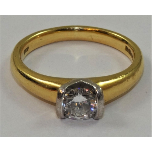 79 - An 18ct gold single stone diamond ring, set with a brilliant cut diamond, stated weight 0.67 cts, co... 