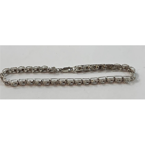 81 - A 9ct white gold and diamond bracelet, set with brilliant cut stones, approximately 050 cts, length ... 