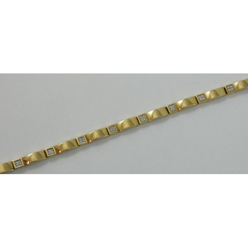 82 - A 9ct gold diamond set bracelet, set with brilliant cut stones, length 19 cm, weight 9 gms.