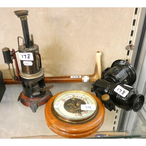 178 - An early cycle lamp, together with a steam engine, barometer and a bone handled walking cane (4).