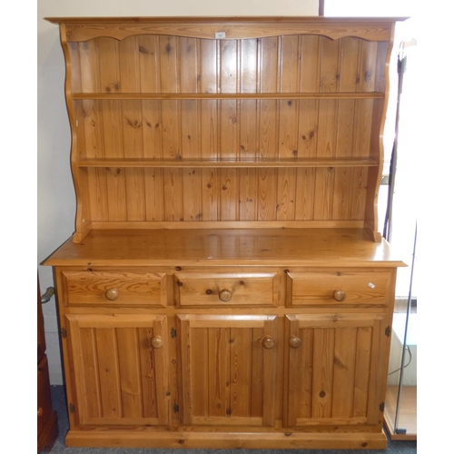 239 - A pine open dresser, approx 140cm wide, 171cm tall, the base with three drawers over three cupboards