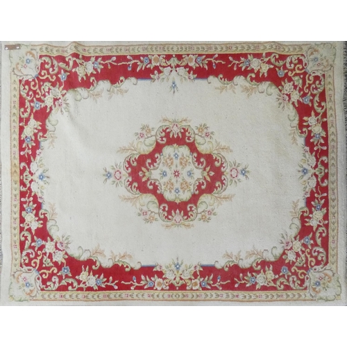 248 - A cream background rug with red border, approx 375x265cm