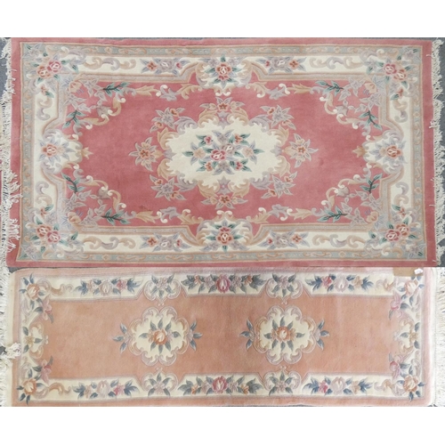 249 - A pink and cream rug, approx 180x280cm and a salmon and cream runner, approx 70x250cm (2)