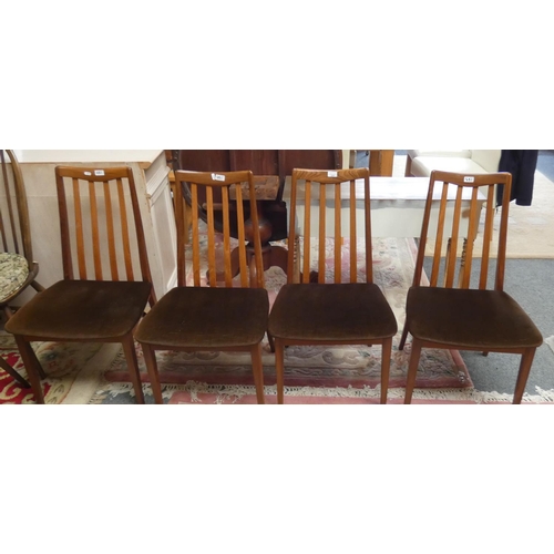 251 - A set of four G-Plan teak slat back dining chairs