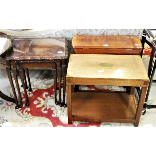 255 - An oak brass bound case table, together with a mahogany nest of tables with glazed tops and a mahoga... 