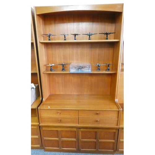 258 - A Nathan teak wall unit, 102cm wide x 194cm tall, the open two shelf top over four drawers and cupbo... 