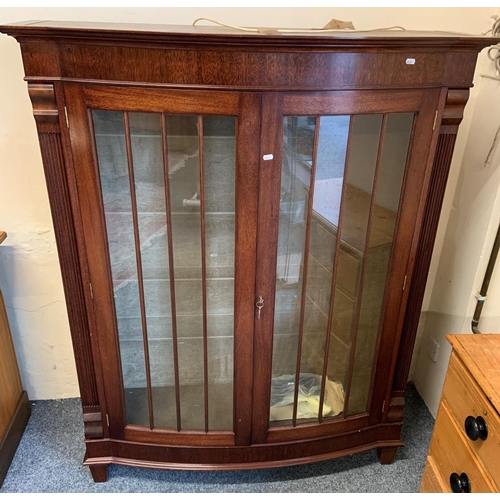 274 - A John L. Corlyon mahogany bow fronted display cabinet, the lined, illuminated interior having four ... 