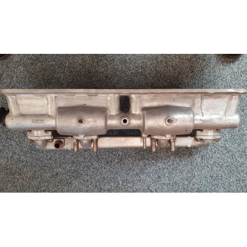 113 - A Jaguar E Type Series 1/Mk 2 alloy cam covers, and a Mk 2 inlet manifold (3).