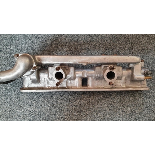 113 - A Jaguar E Type Series 1/Mk 2 alloy cam covers, and a Mk 2 inlet manifold (3).