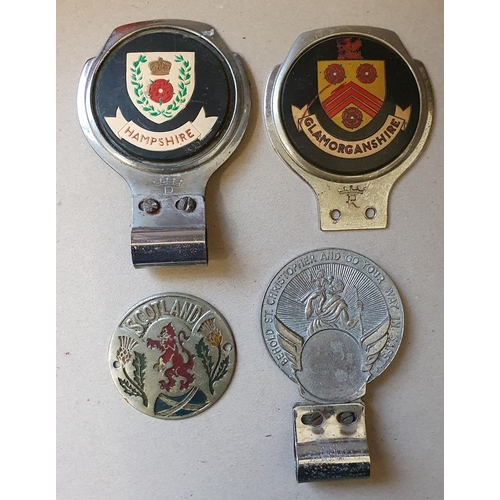 69 - A Scotland enamel grill badge, together with three bumper badges, Hampshire, Glamorganshire and a St... 