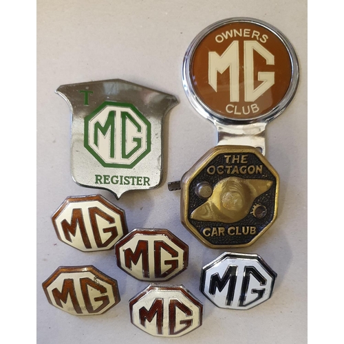 70 - A collection of MG badges, including a T Register bumper badge and four brown and enamel centres.