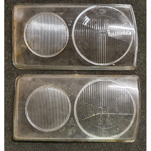 132 - A pair of Mercedes W123 glass H4 headlamp covers.